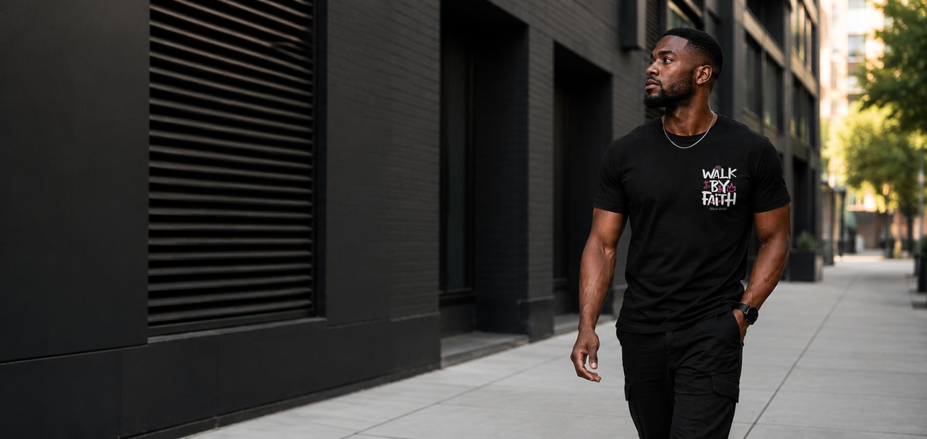 Man wearing a black Walk By Faith Christian T-shirt from Jesus Alone Apparel